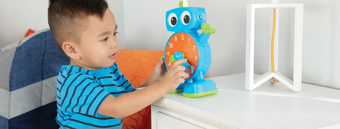 Boy plays with battery powered toy